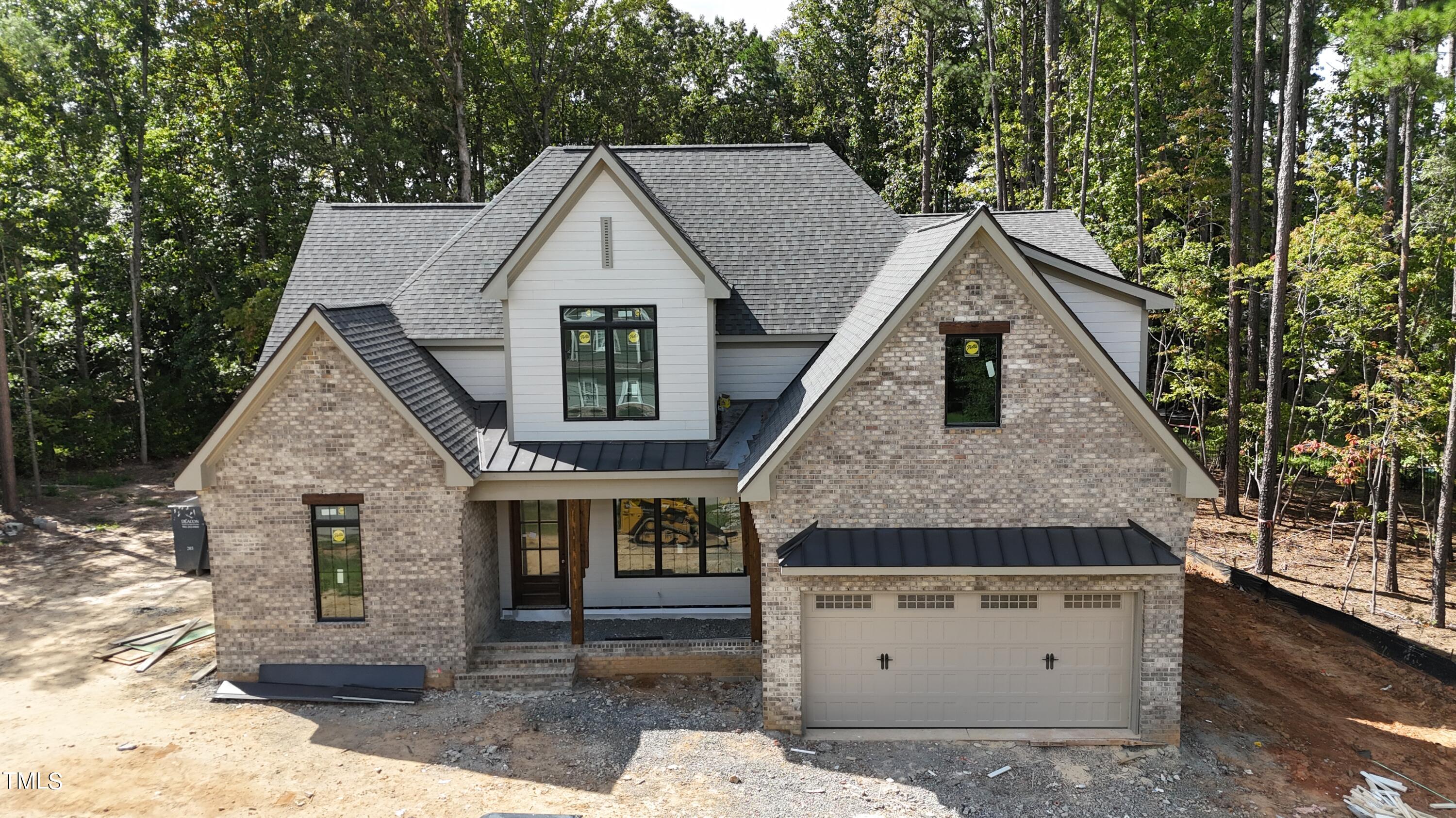 a aerial view of a house with a yard