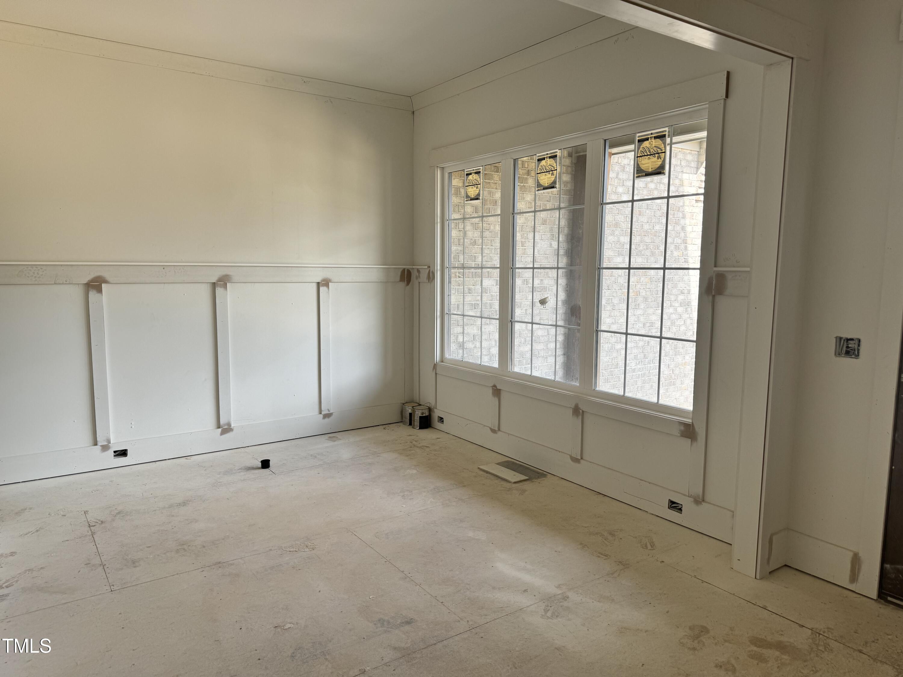 8544 Hurst Drive Raleigh, NC 27603 - Photo 13 of 26 an empty room with windows