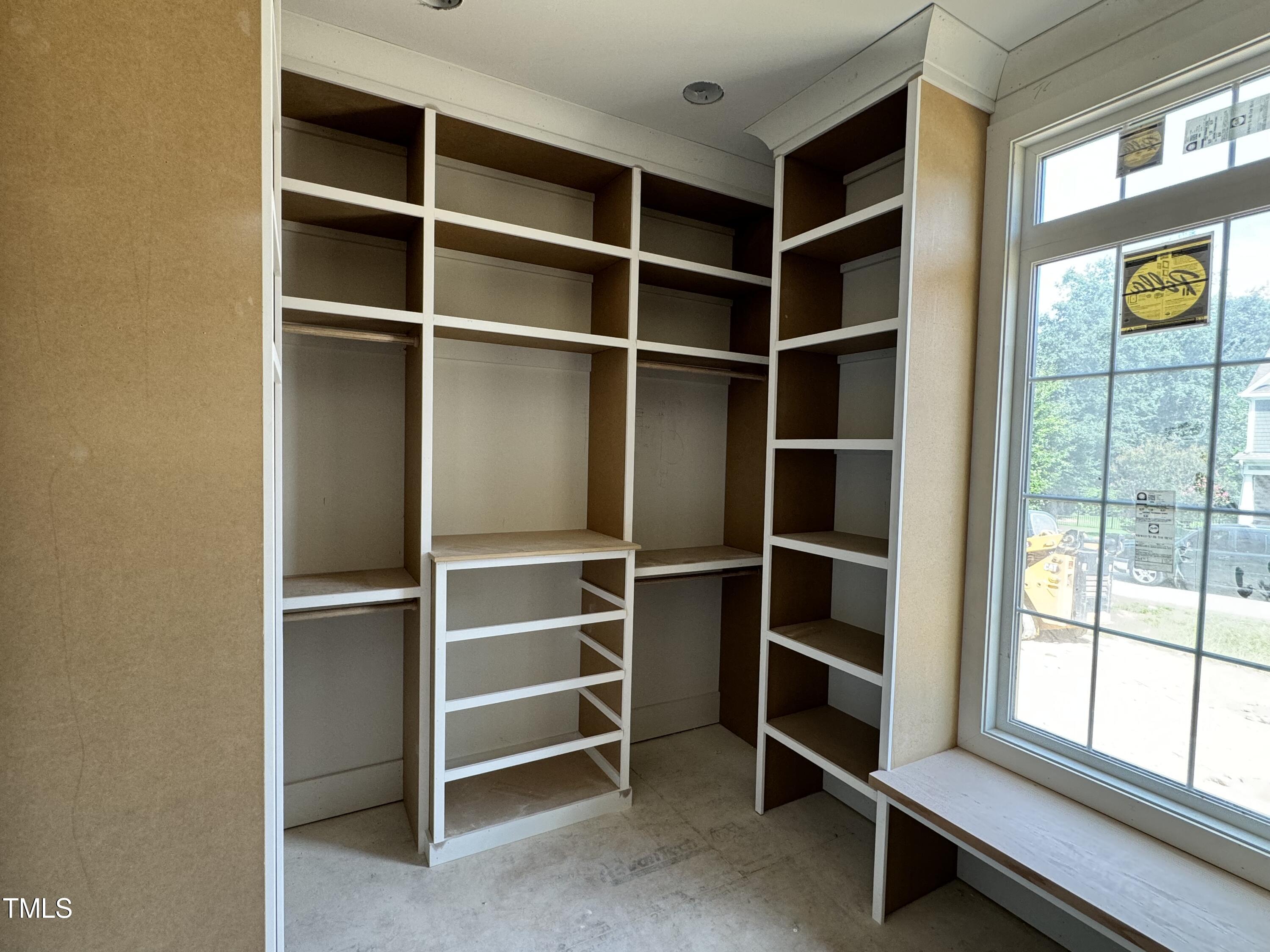 8544 Hurst Drive Raleigh, NC 27603 - Photo 18 of 26 a view of walk in closet with empty racks
