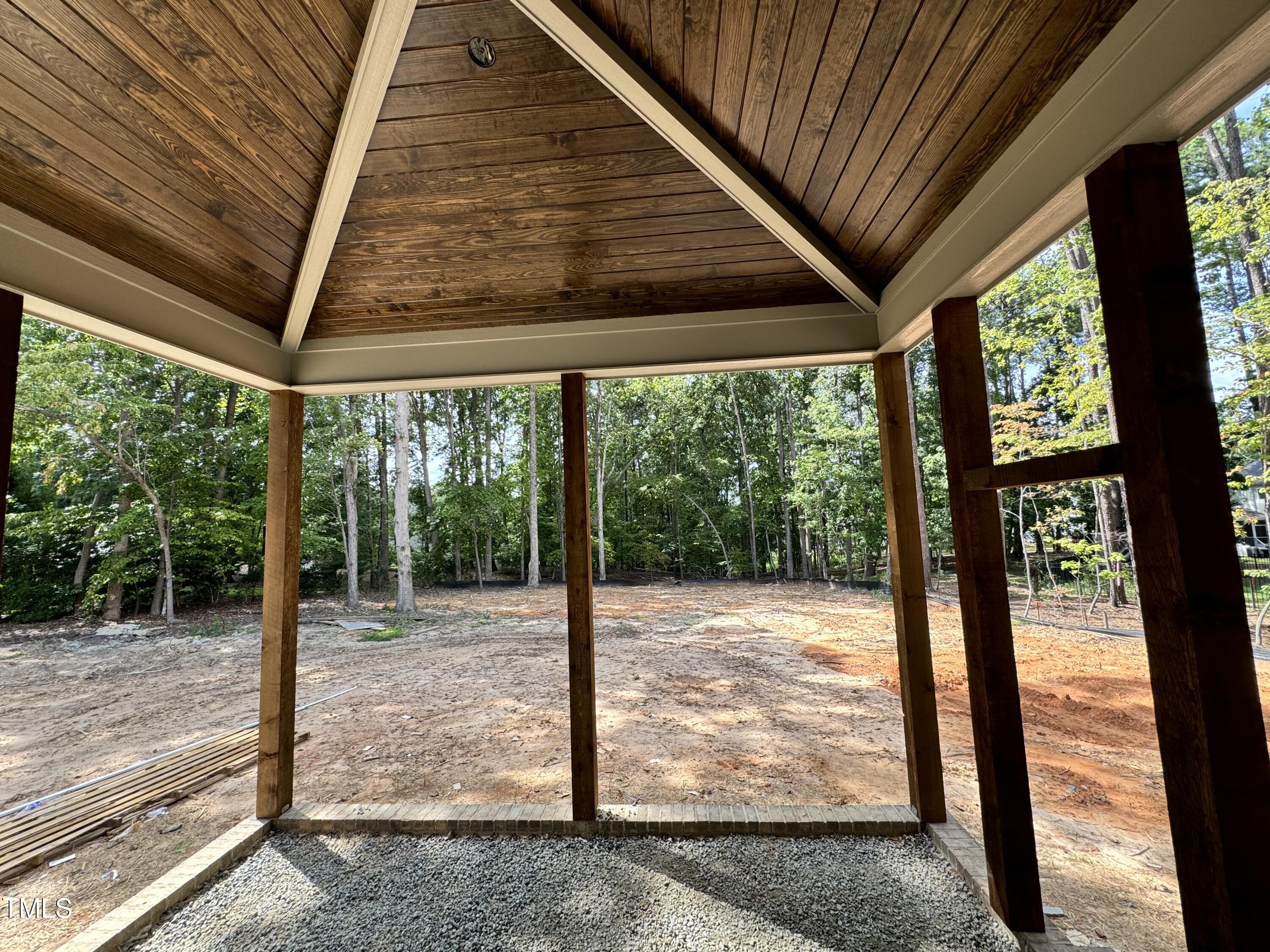 8544 Hurst Drive Raleigh, NC 27603 - Photo 24 of 26 a view of a room with wooden floor and iron stairs