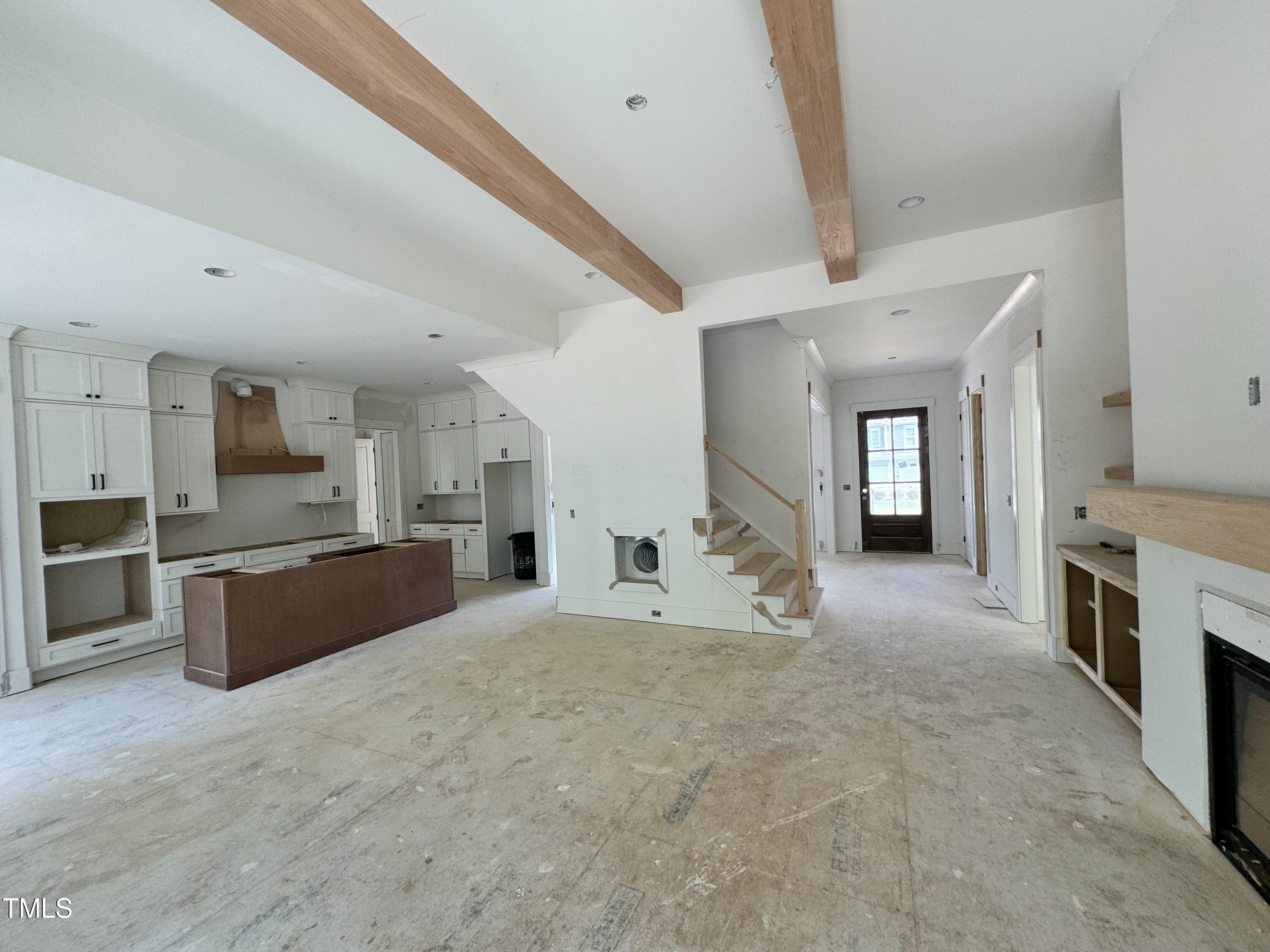 8544 Hurst Drive Raleigh, NC 27603 - Photo 6 of 26 a large white kitchen with stainless steel appliances granite countertop a large counter top a stove and a sink