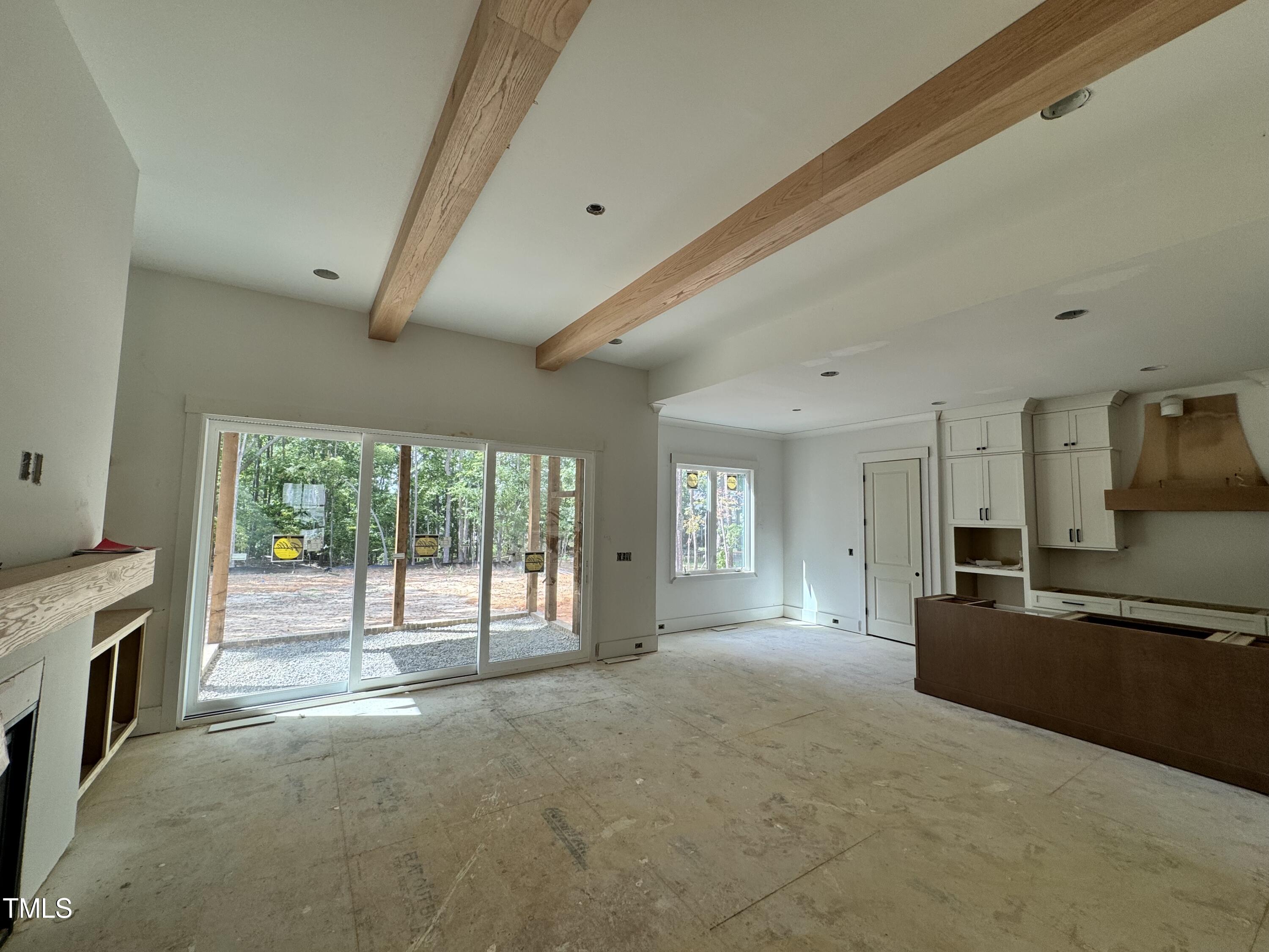 8544 Hurst Drive Raleigh, NC 27603 - Photo 9 of 26 a view of an empty room with a fireplace