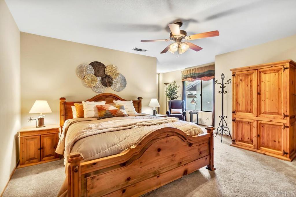 2302 Shaylene Way Alpine, CA 91901 - Photo 20 of 46 a bedroom with a bed and wooden floor