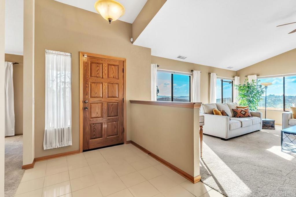 2302 Shaylene Way Alpine, CA 91901 - Photo 2 of 46 a living room with furniture and a chandelier