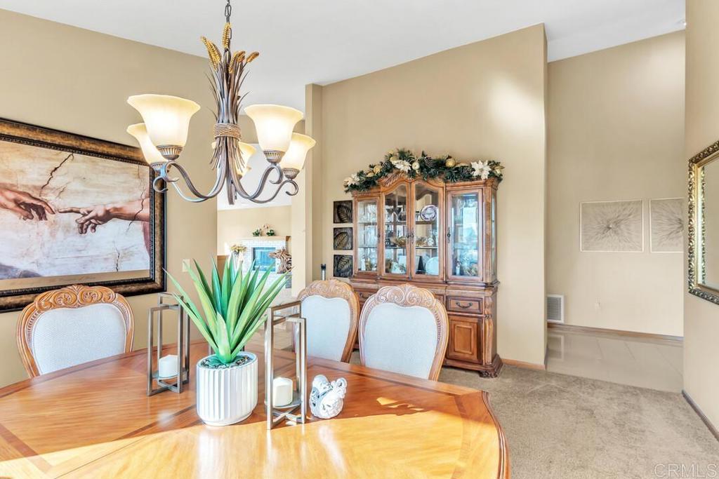 2302 Shaylene Way Alpine, CA 91901 - Photo 21 of 46 a dining room with furniture and chandelier