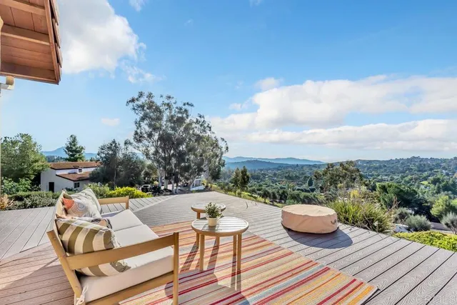 swimming pool view with a seating space