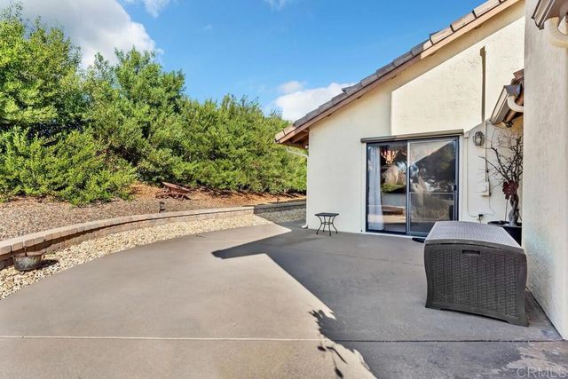 a view of backyard with outdoor seating