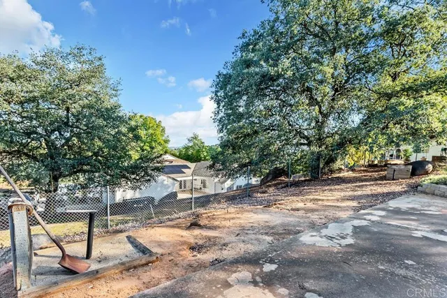 a view of a backyard with a bench