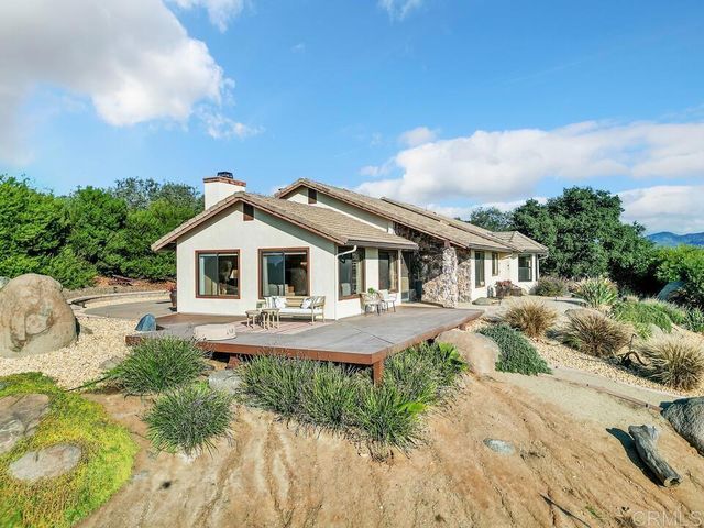 a aerial view of a house with swimming pool and porch