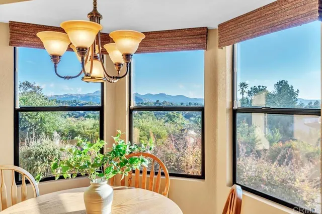 a glass vase with flowers on a table