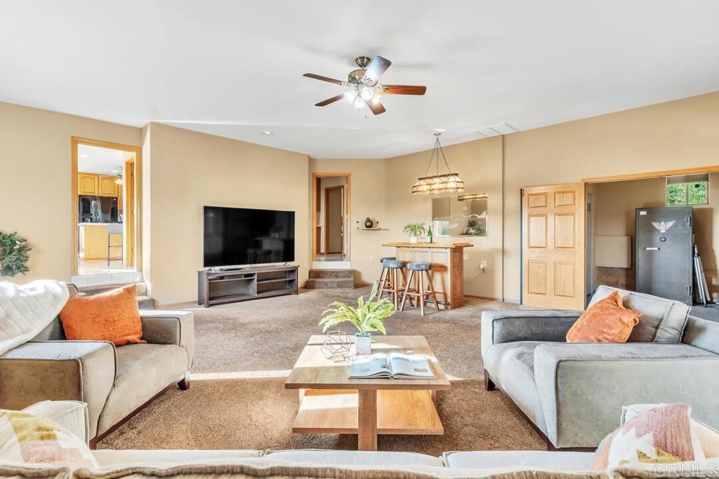 2302 Shaylene Way Alpine, CA 91901 - Photo 9 of 46 a living room with furniture and a flat screen tv