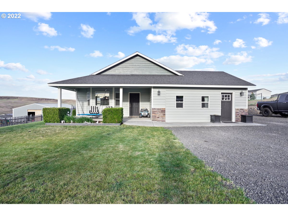 1370 Childers Road Arlington, OR 97812 - Photo 1 of 31 a view of a house with backyard sitting area and garden