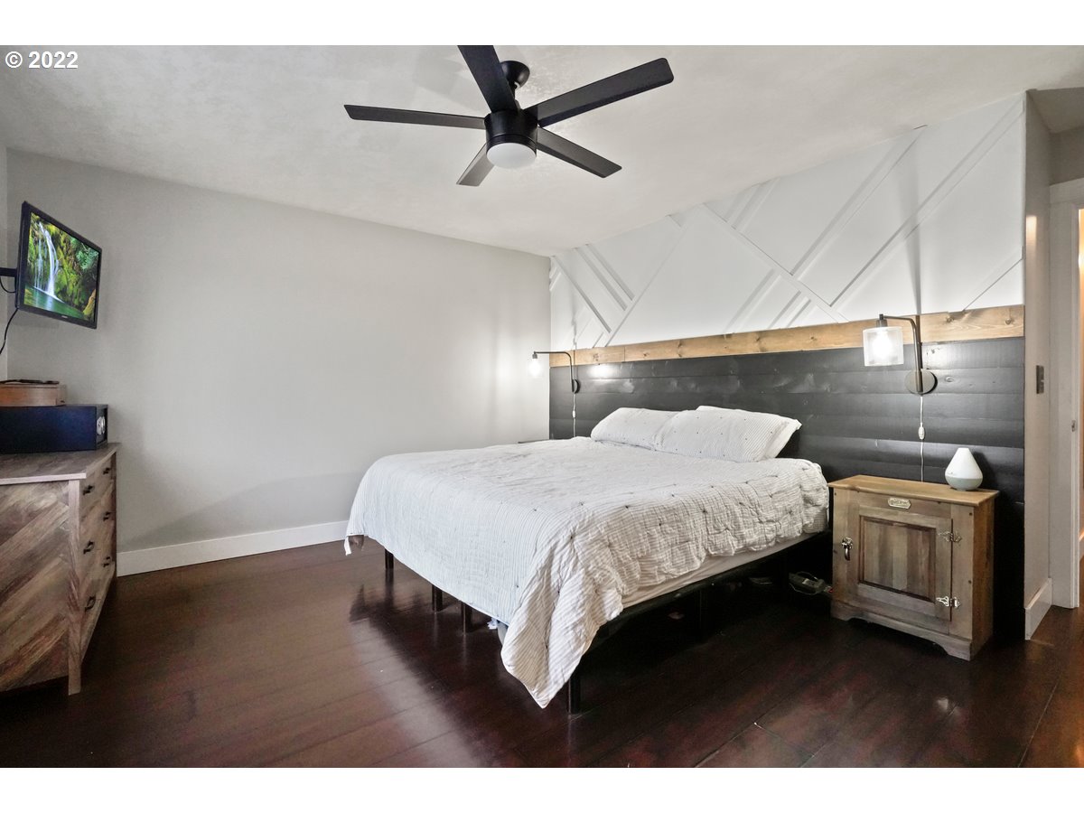 1370 Childers Road Arlington, OR 97812 - Photo 11 of 31 a bedroom with a bed and a ceiling fan