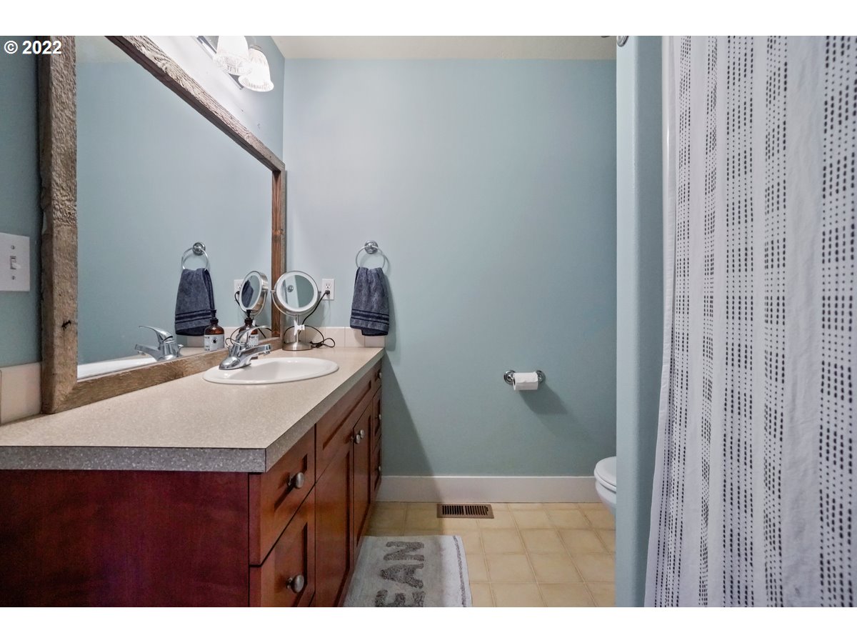 1370 Childers Road Arlington, OR 97812 - Photo 13 of 31 a bathroom with a sink and a mirror