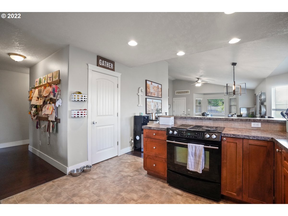 1370 Childers Road Arlington, OR 97812 - Photo 20 of 31 a kitchen with stainless steel appliances granite countertop a stove sink and cabinets