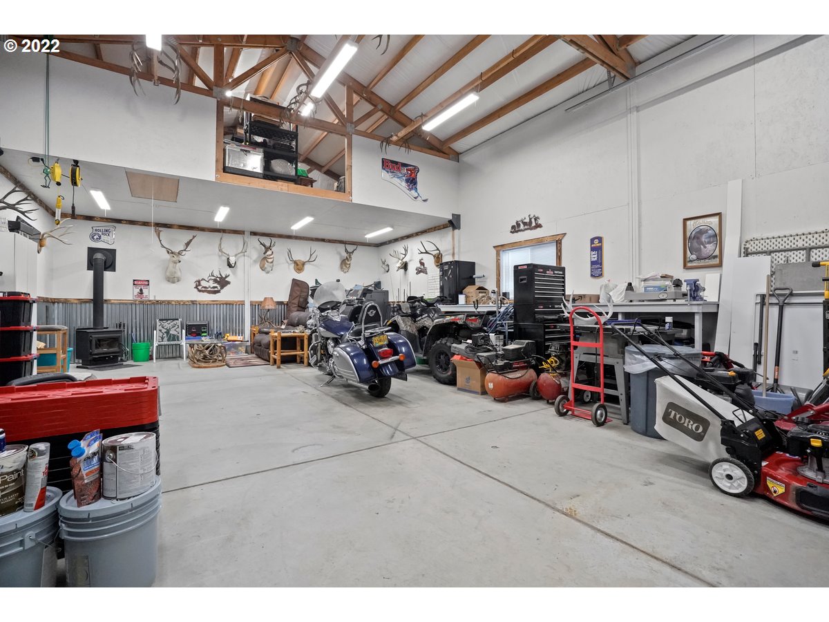 1370 Childers Road Arlington, OR 97812 - Photo 24 of 31 a view of a garage with a bike and a car