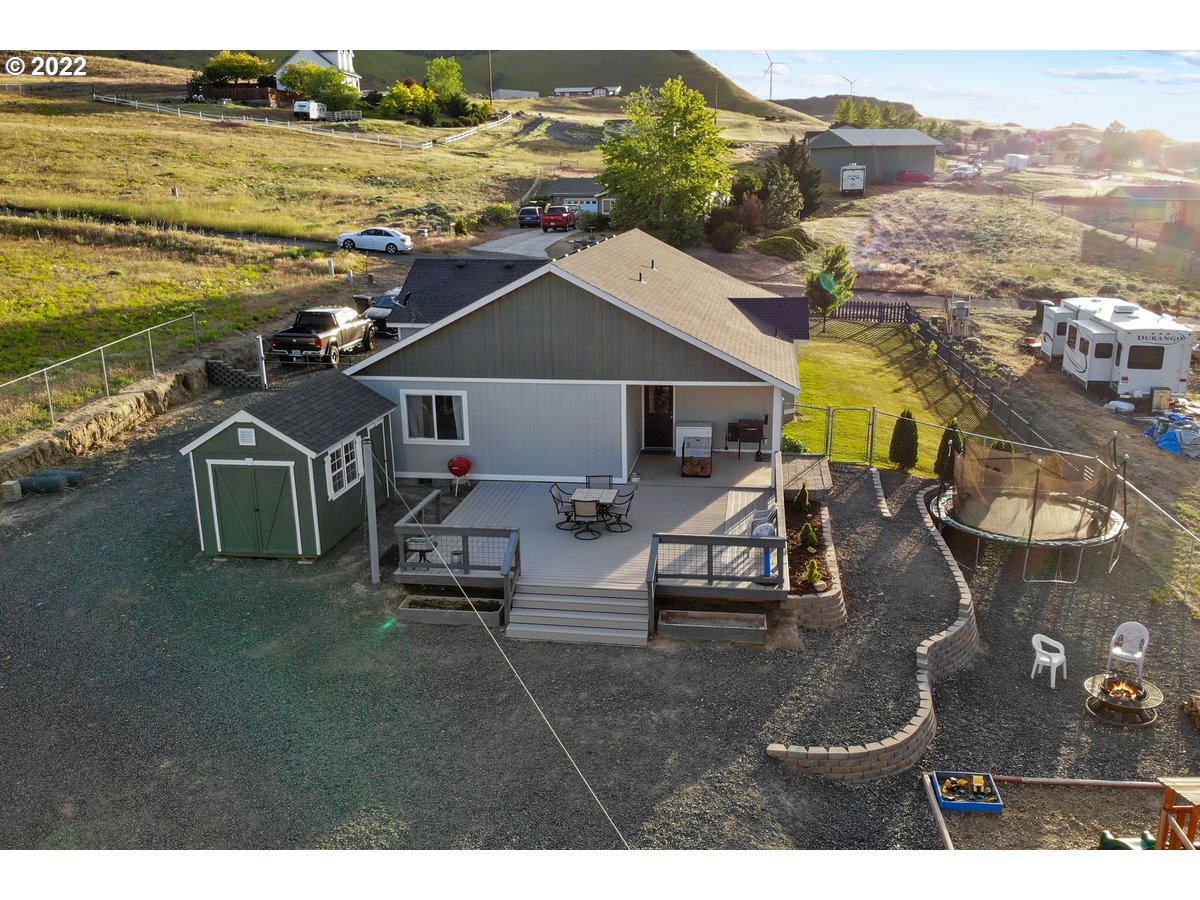 1370 Childers Road Arlington, OR 97812 - Photo 28 of 31 a view of a swimming pool with lounge chair