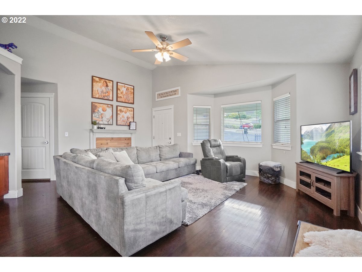 1370 Childers Road Arlington, OR 97812 - Photo 8 of 31 a living room with furniture and a flat screen tv