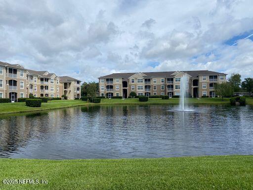 a view of a lake with building and outdoor space
