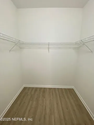 a view of an empty walk in closet