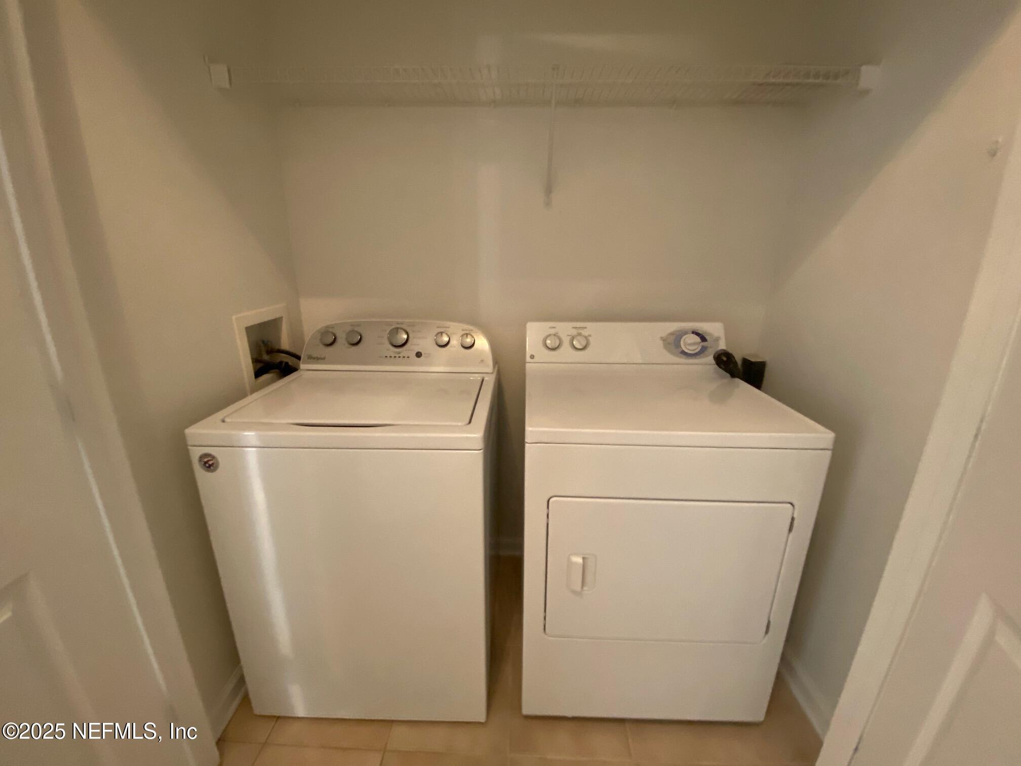 7990 Baymeadows Road, Unit 929 Jacksonville, FL 32256 - Photo 23 of 26 a utility room with dryer and washer