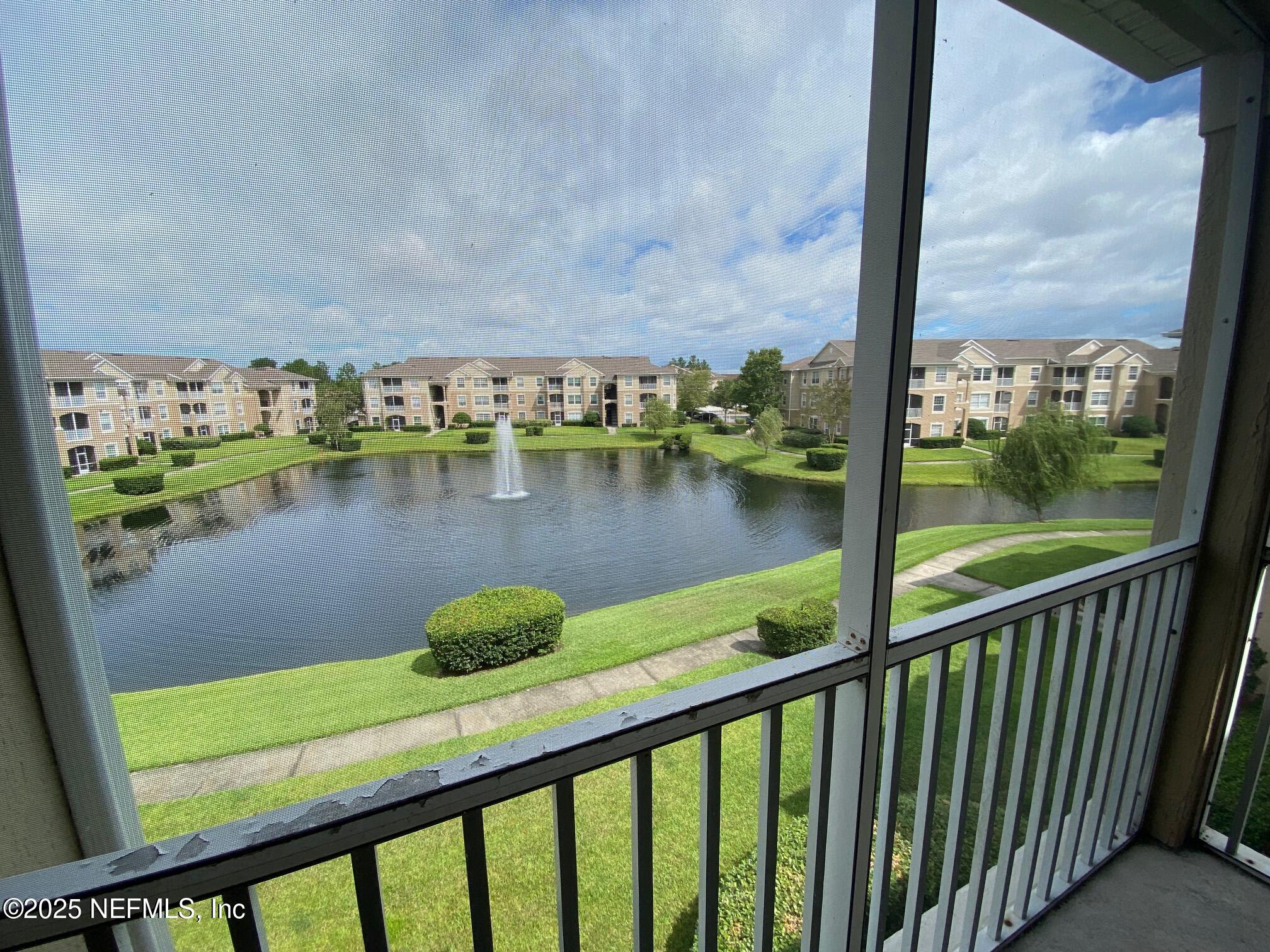 7990 Baymeadows Road, Unit 929 Jacksonville, FL 32256 - Photo 26 of 26 a view of a lake from a balcony