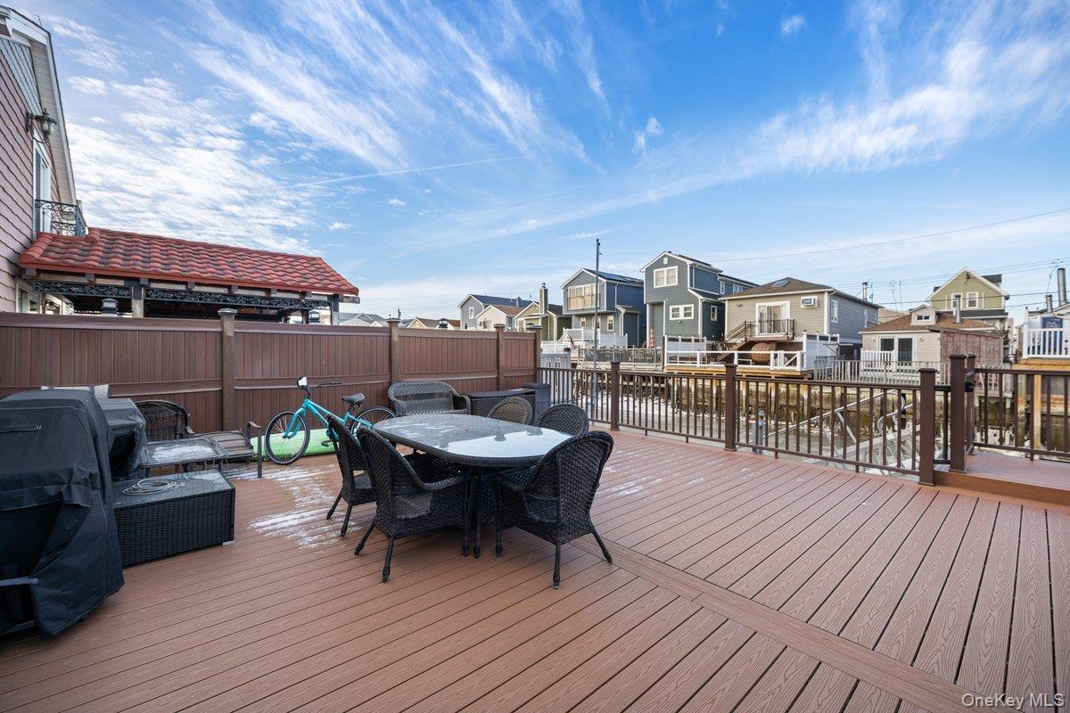 19 West 13th Road Queens, NY 11693 - Photo 13 of 19 a view of a rooftop deck with couch and chairs