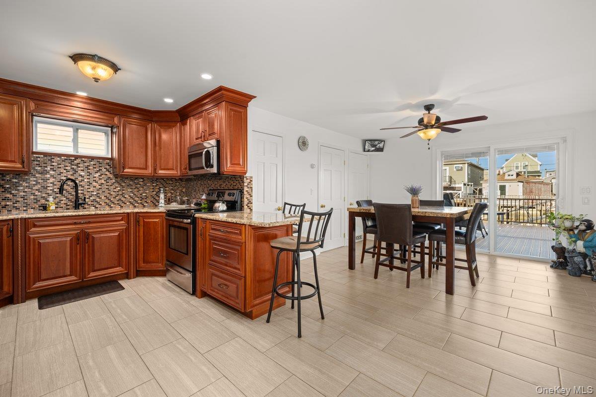 19 West 13th Road Queens, NY 11693 - Photo 7 of 19 a kitchen with a sink a counter top space and appliances