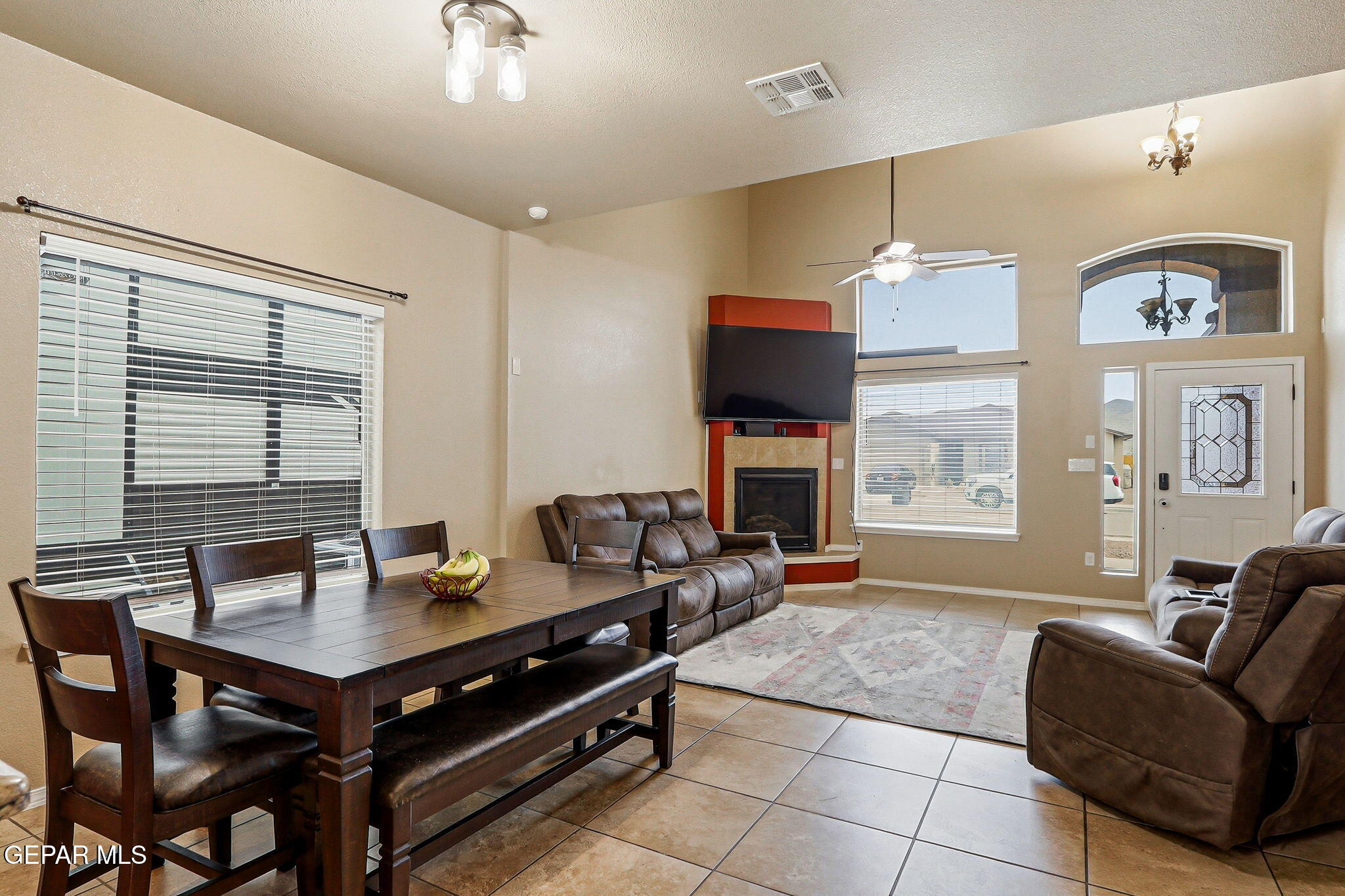 612 Bell Gordon Street Anthony, TX 79821 - Photo 12 of 64 a living room with furniture a table and a large window