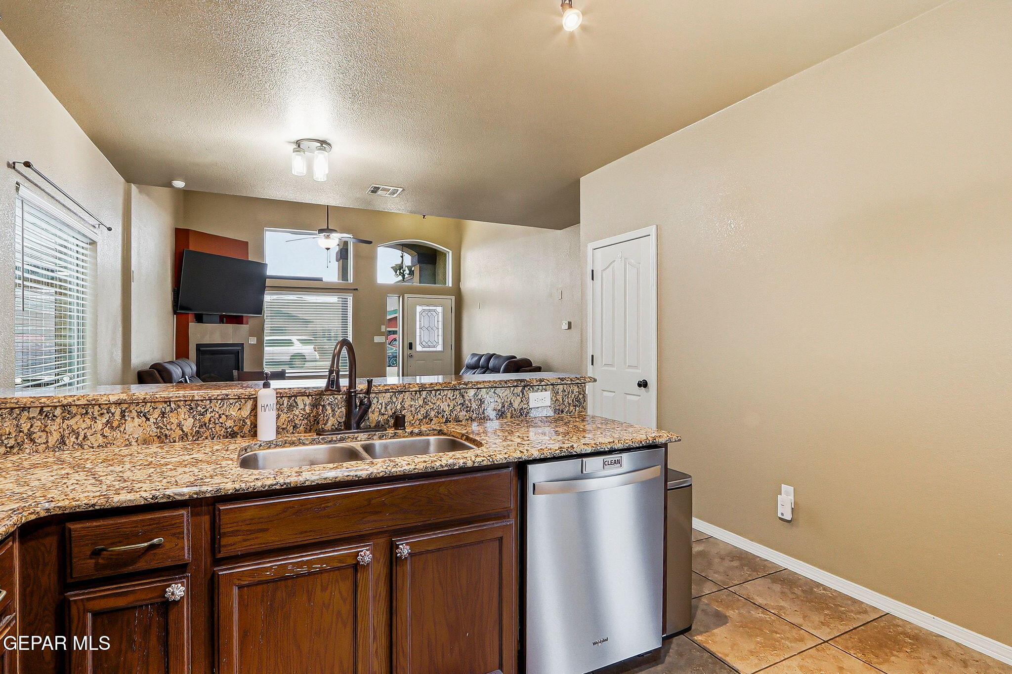 612 Bell Gordon Street Anthony, TX 79821 - Photo 16 of 64 a bathroom with a granite countertop sink and a mirror
