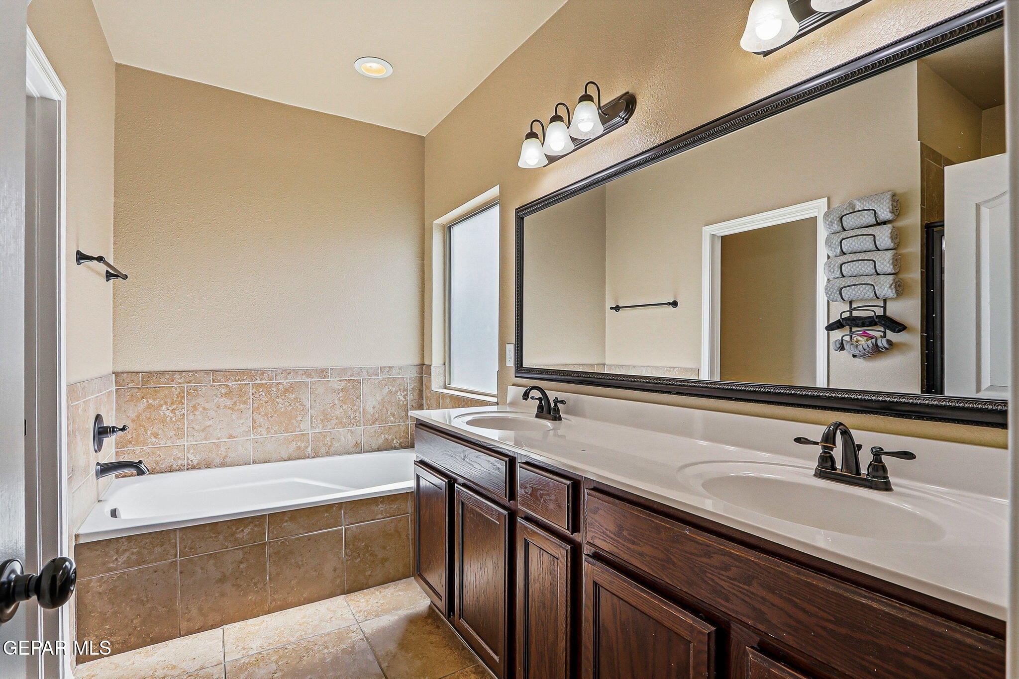 612 Bell Gordon Street Anthony, TX 79821 - Photo 20 of 64 a bathroom with a bathtub and a sink