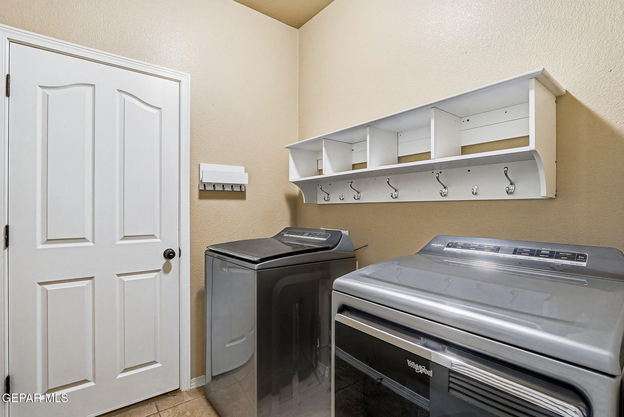 612 Bell Gordon Street Anthony, TX 79821 - Photo 22 of 64 a utility room with dryer and washer
