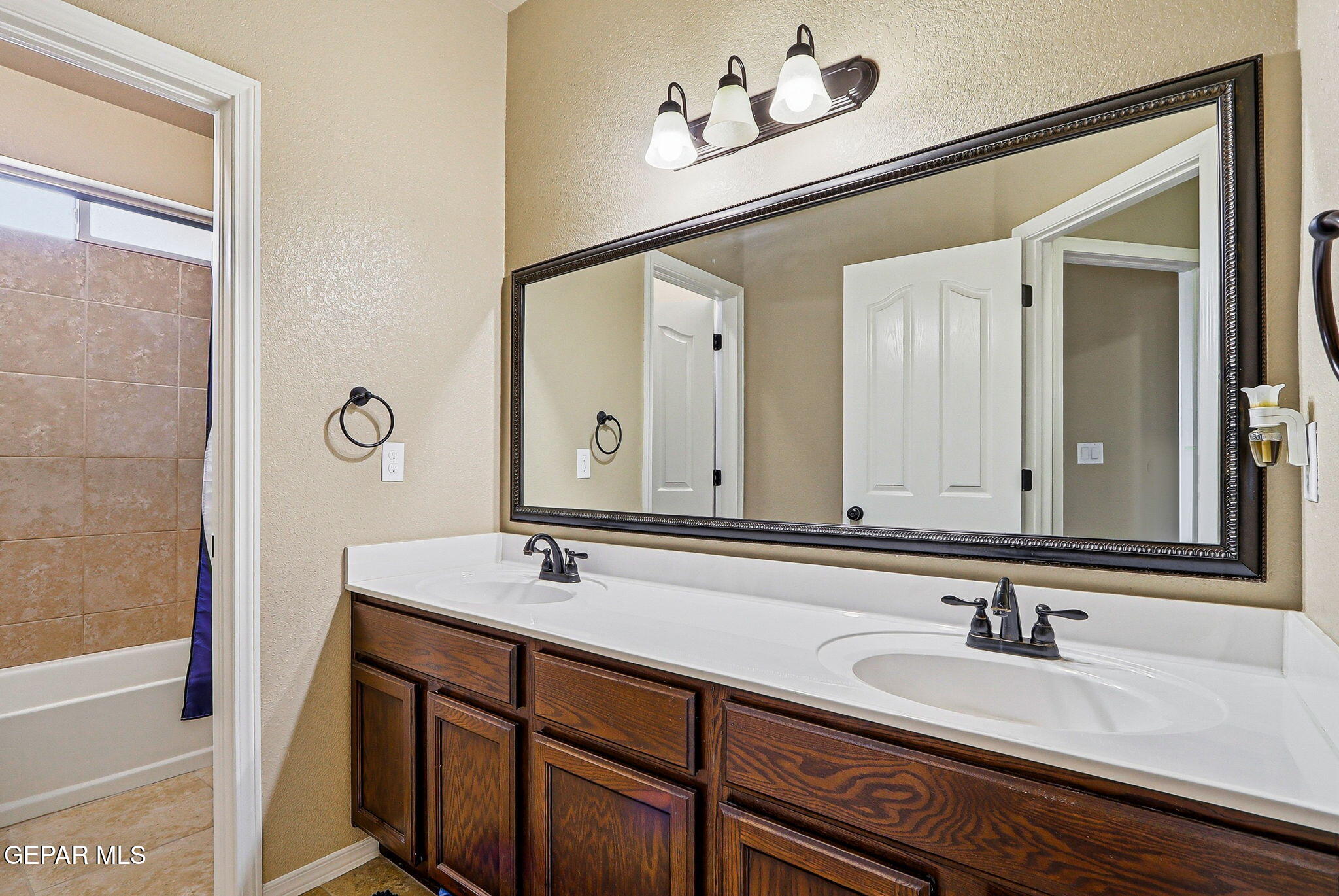 612 Bell Gordon Street Anthony, TX 79821 - Photo 25 of 64 a bathroom with a sink and a mirror