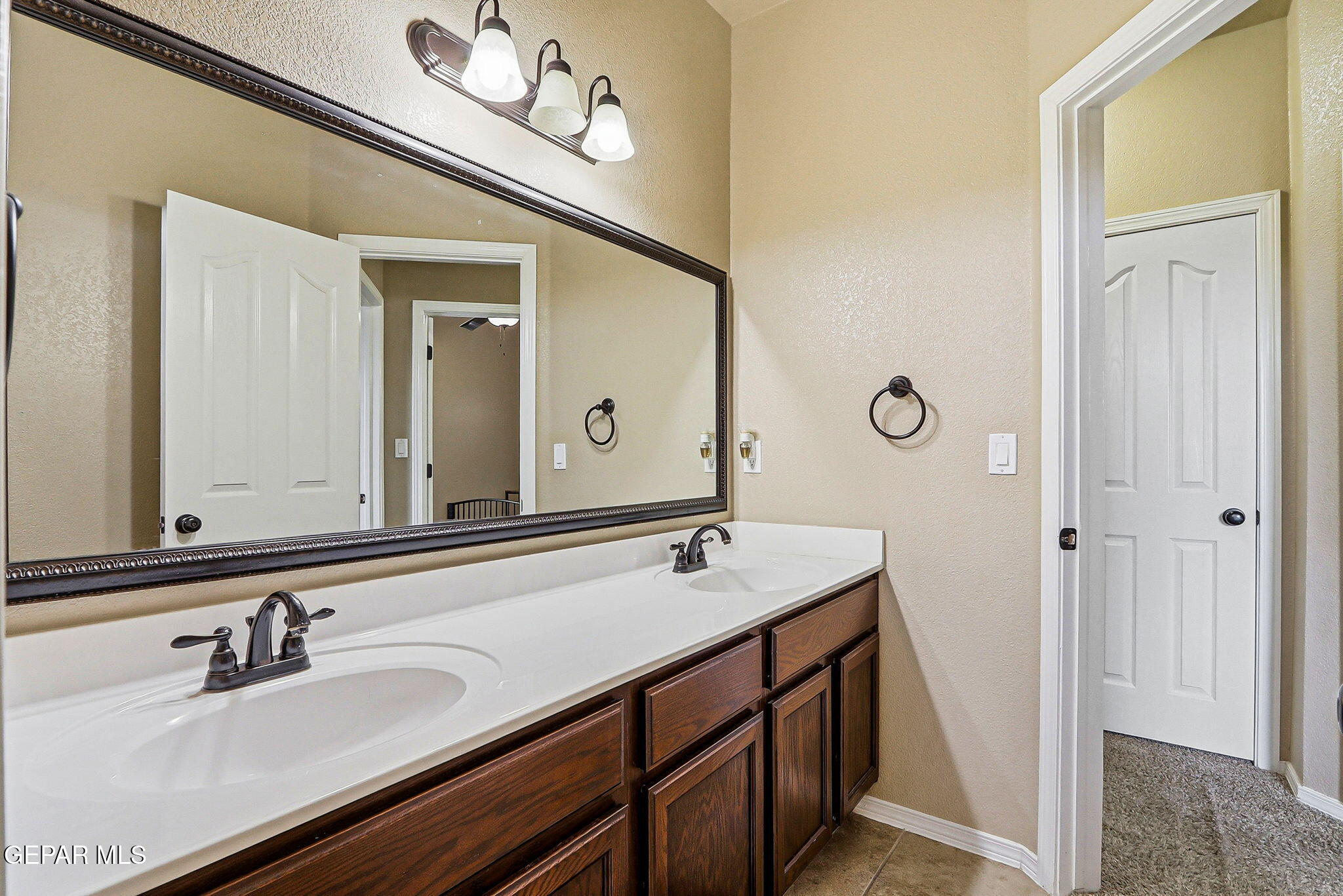 612 Bell Gordon Street Anthony, TX 79821 - Photo 26 of 64 a bathroom with a sink and a mirror