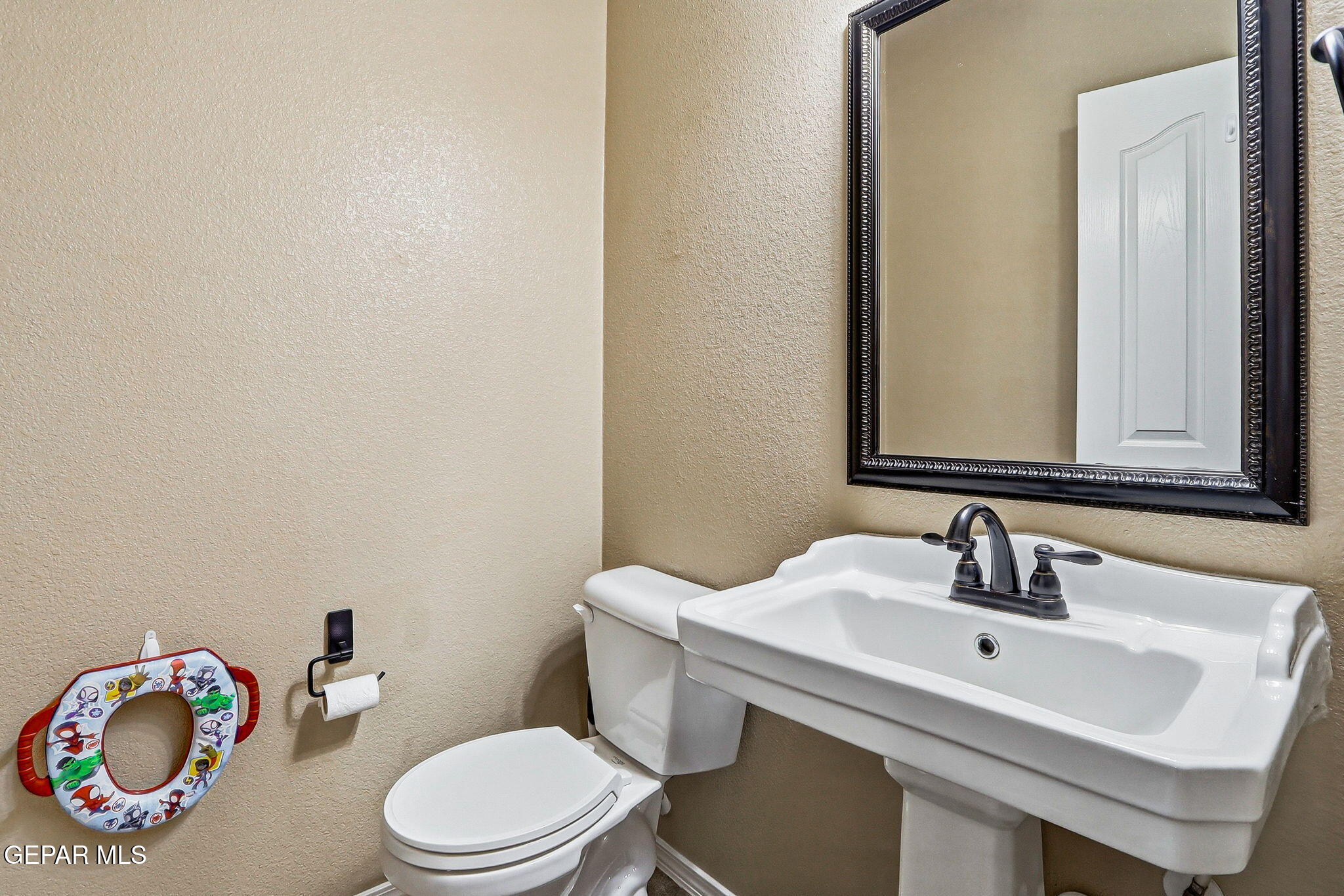 612 Bell Gordon Street Anthony, TX 79821 - Photo 29 of 64 a bathroom with a sink vanity mirror and toilet