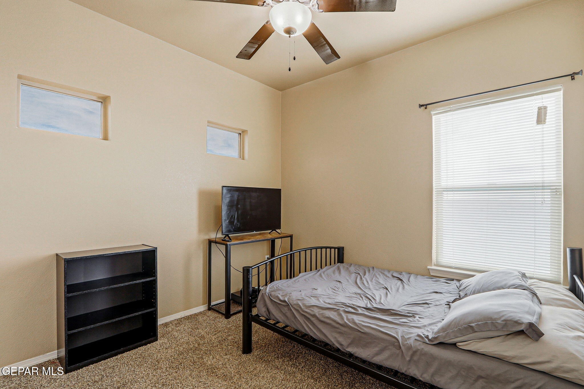 612 Bell Gordon Street Anthony, TX 79821 - Photo 30 of 64 a bedroom with a bed and a flat screen tv