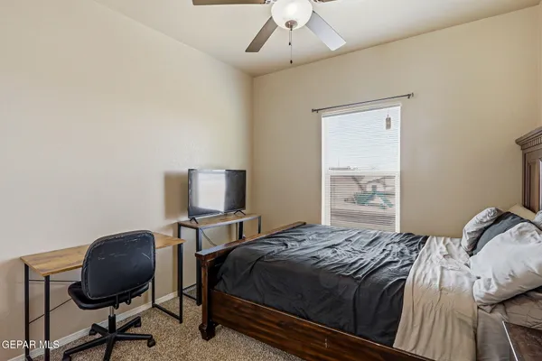 a view of kitchen living room with a flat screen tv and floor to ceiling window