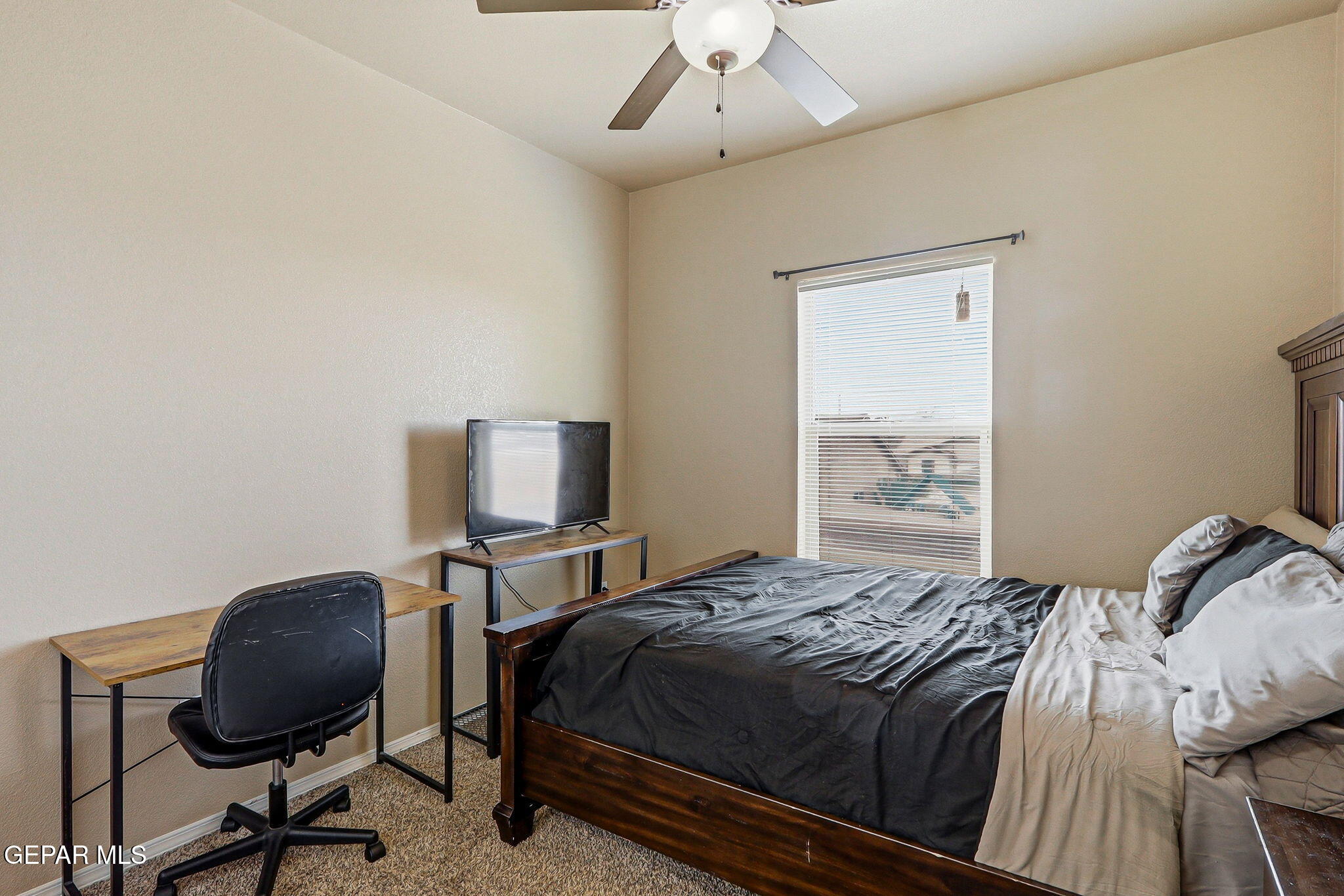 612 Bell Gordon Street Anthony, TX 79821 - Photo 32 of 64 a bedroom with a bed and a desk