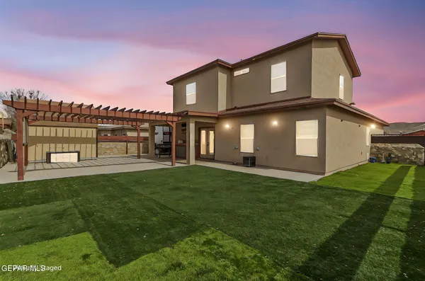 an aerial view of a house with outdoor space
