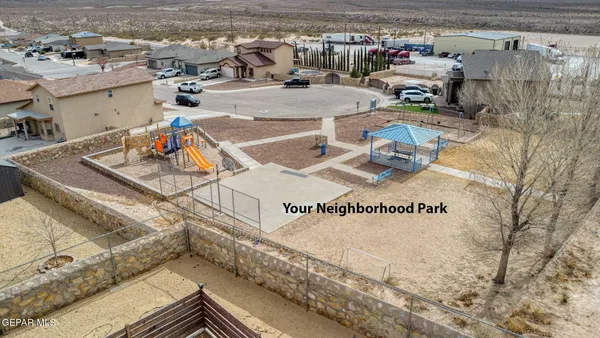 an aerial view of a residential houses with outdoor space