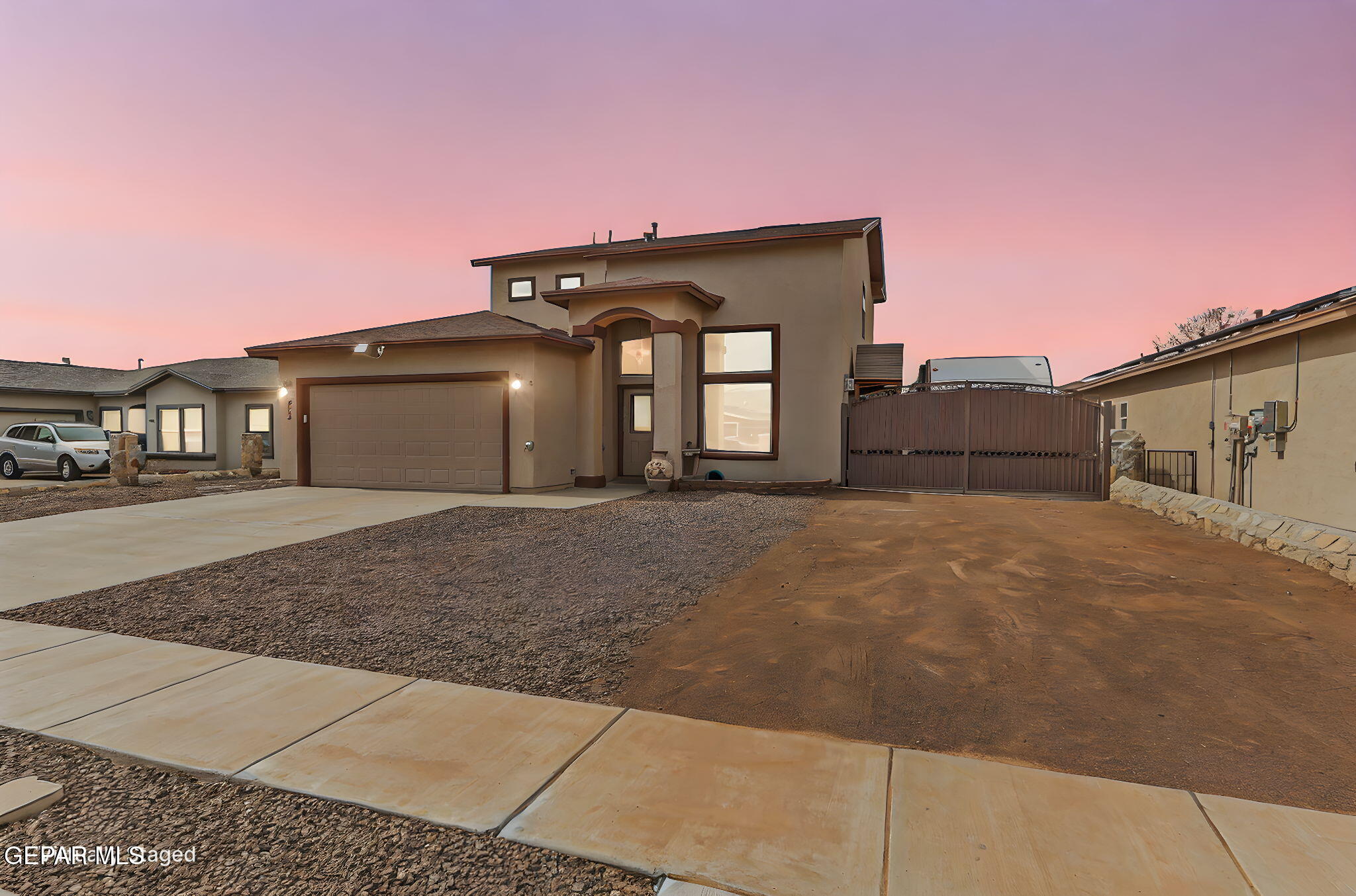 612 Bell Gordon Street Anthony, TX 79821 - Photo 6 of 64 a front view of a house with a big yard and garage