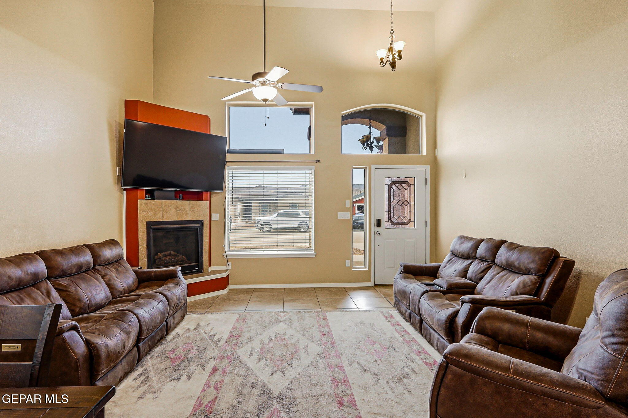612 Bell Gordon Street Anthony, TX 79821 - Photo 8 of 64 a living room with furniture a fireplace and a flat screen tv