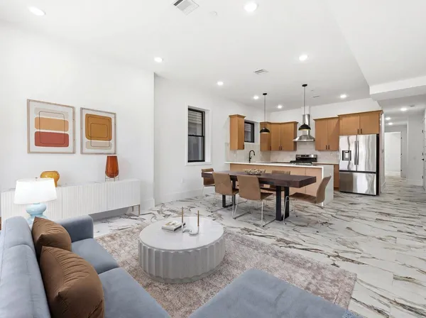 a living room with furniture and a table