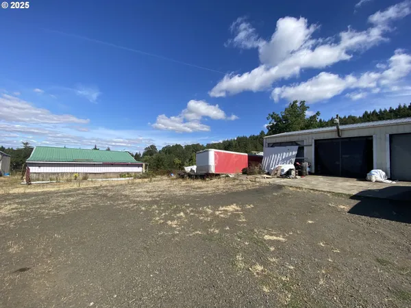 a front view of a house with a yard and a garage