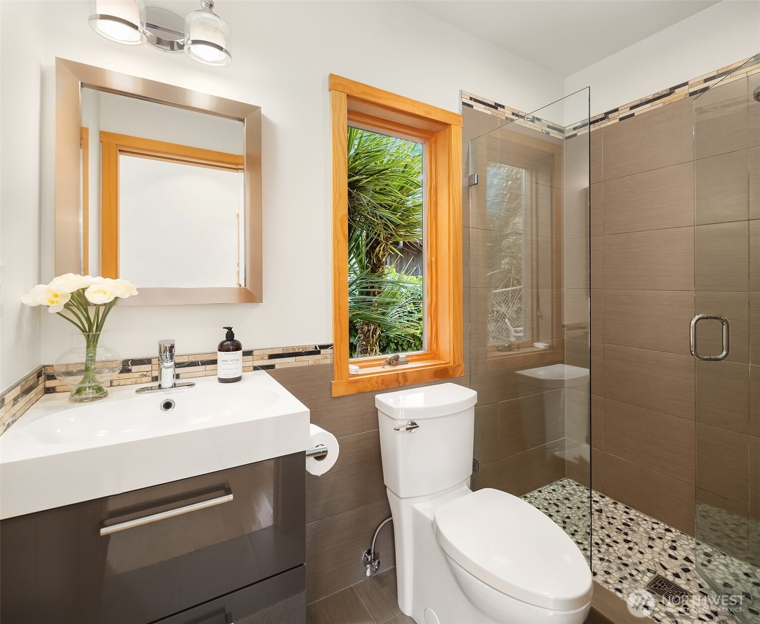 16947 Maplewild Avenue Southwest Burien, WA 98166 - Photo 12 of 23 a bathroom with a sink mirror vanity and a toilet