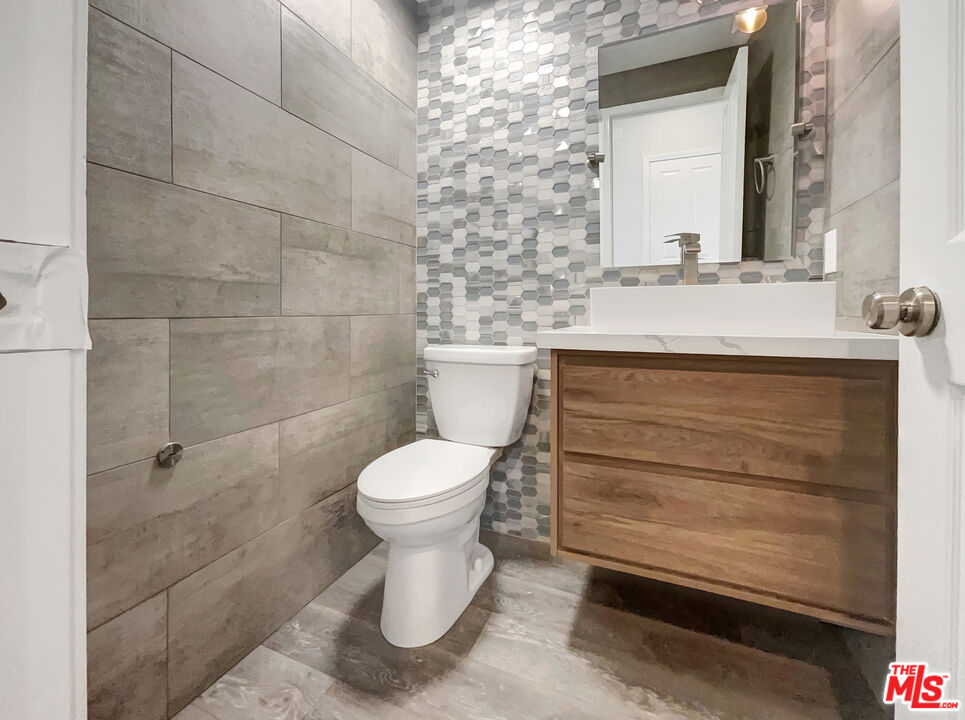 125 Lakeside Drive Buena Park, CA 90621 - Photo 14 of 57 a bathroom with a sink toilet and shower