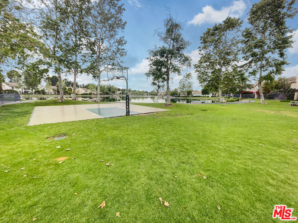 125 Lakeside Drive Buena Park, CA 90621 - Photo 16 of 57 a view of yard with swimming pool and trees