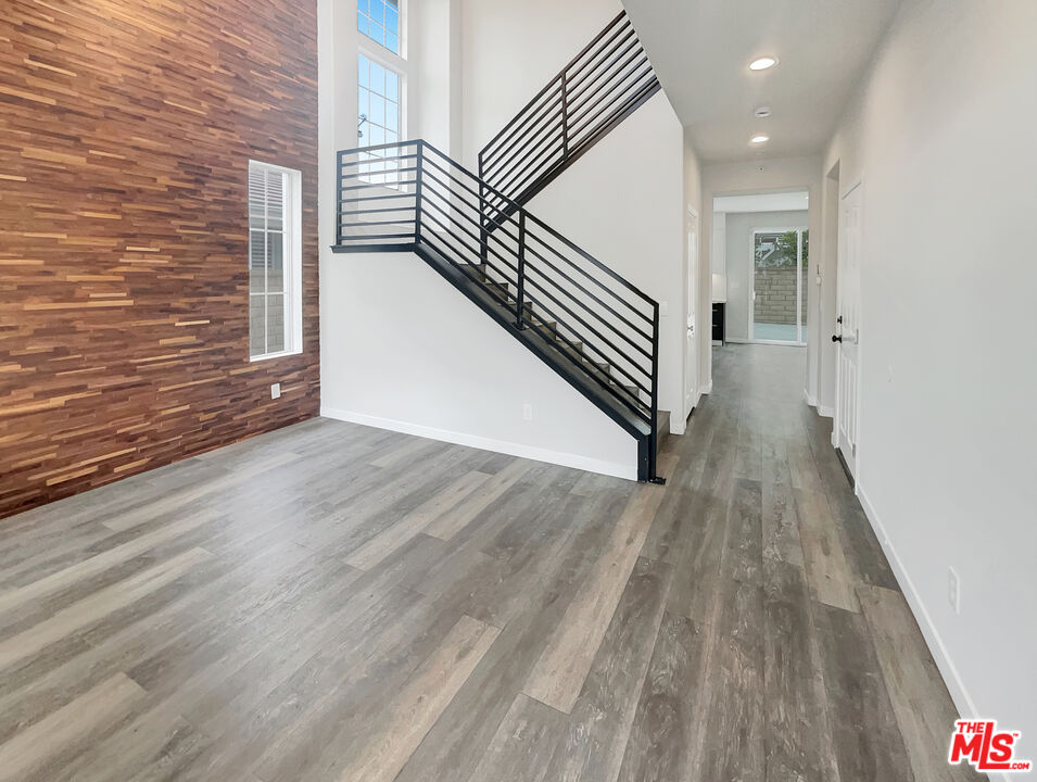 125 Lakeside Drive Buena Park, CA 90621 - Photo 23 of 57 a view of a hallway with wooden floor and stairs