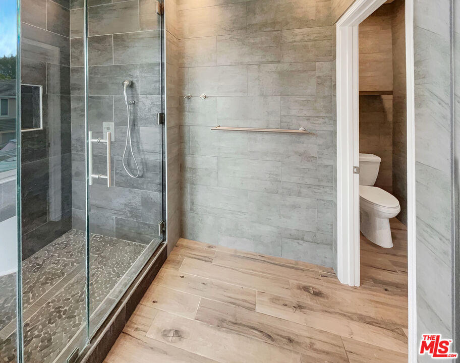 125 Lakeside Drive Buena Park, CA 90621 - Photo 45 of 57 a bathroom with a shower and toilet