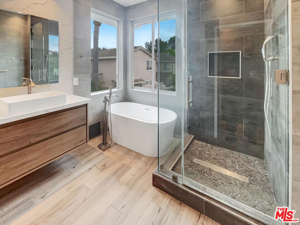 125 Lakeside Drive Buena Park, CA 90621 - Photo 47 of 57 a bathroom with a tub shower and sink